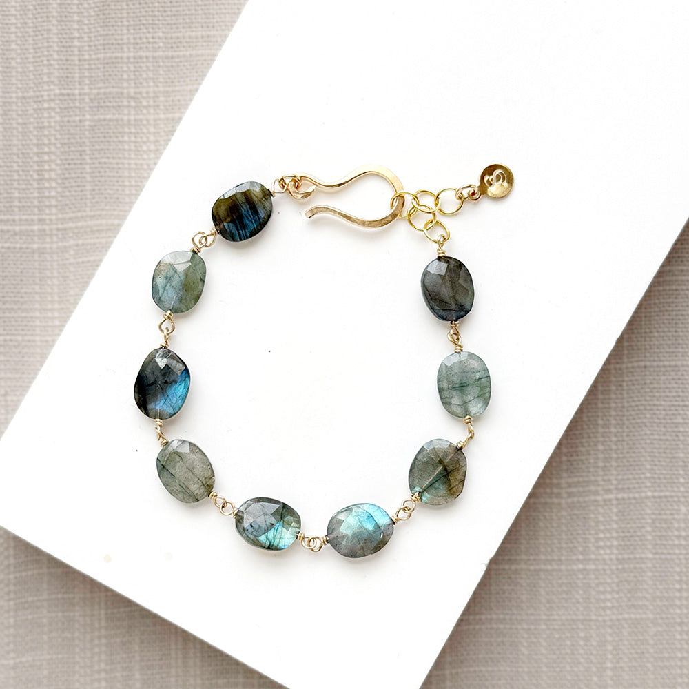 Labradorite bracelet with a handmade clasp in a white dish