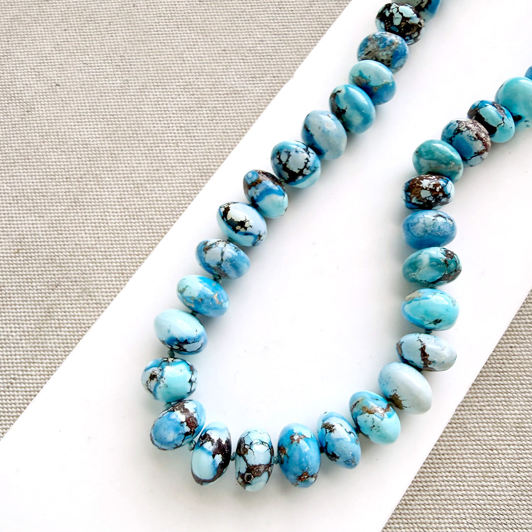 golden hills turquoise necklace with 12.5 - 14 mm size beads on a white background