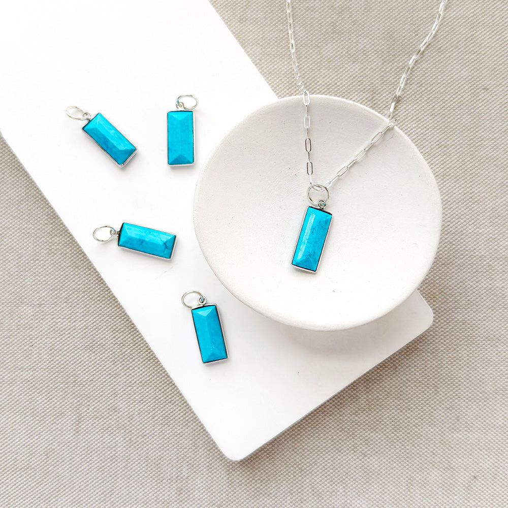 Rectangular bezel set blue howlite charm in silver