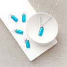 Rectangular bezel set blue howlite charm in silver