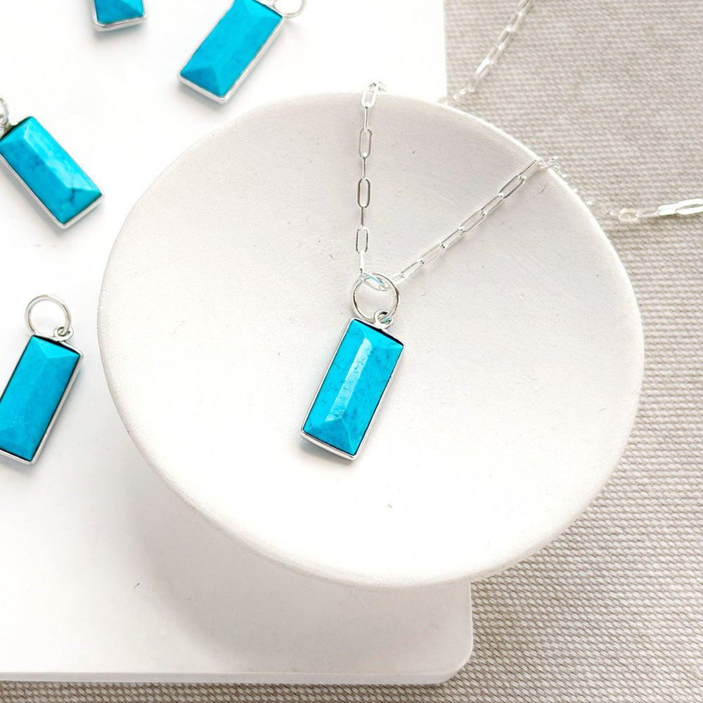 Rectangular bezel set blue howlite charm in silver