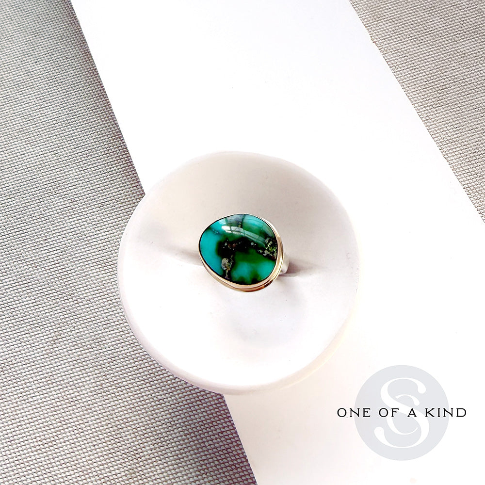Sonoran Turquoise mixed metal ring in a white dish