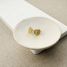 Hammered disc stud with a small inset CZ on a white background