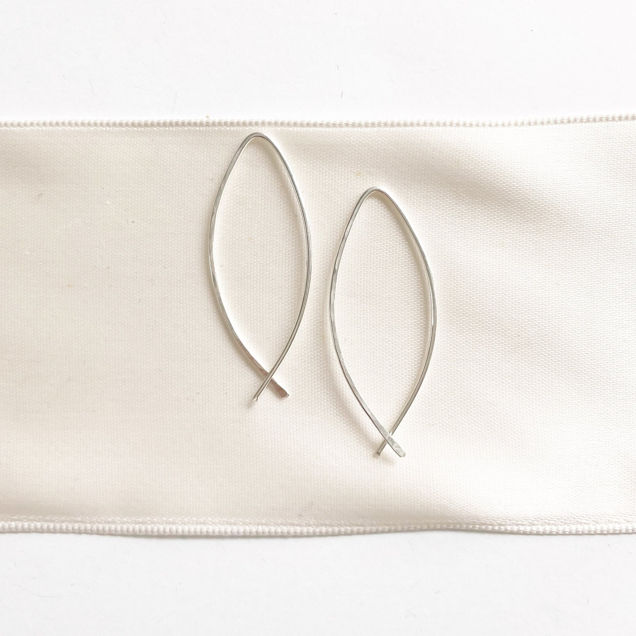Alice Earrings by Sarah Cornwell Jewelry. Simple lightweight silver threader earrings on white background.
