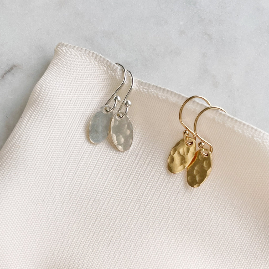 Gold and Silver Brooklyn Earrings by Sarah Cornwell Jewelry. Dainty textured oval earrings with a .5 in drop on a white background.