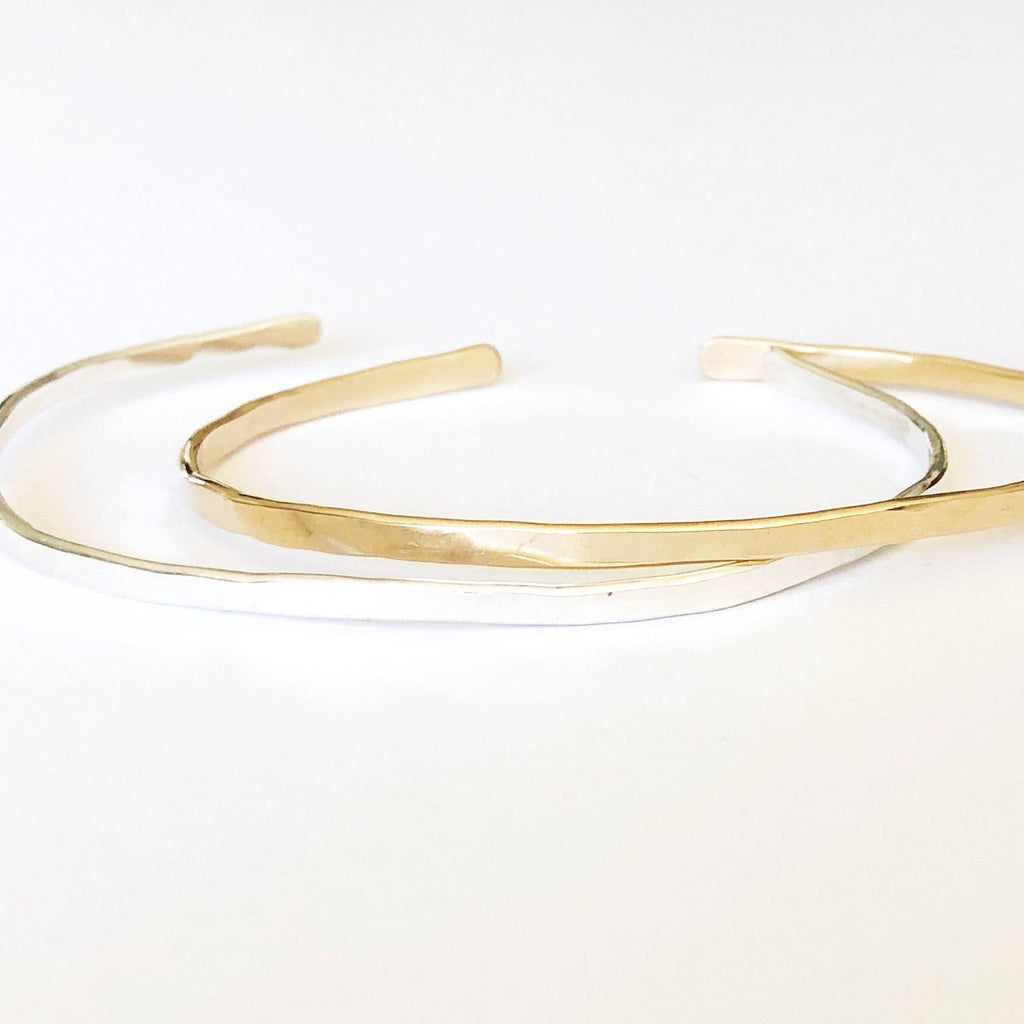 2 gold and silver textured bangle bracelets with initials stamped on both ends. Charlie Bangle by Sarah Cornwell Jewelry