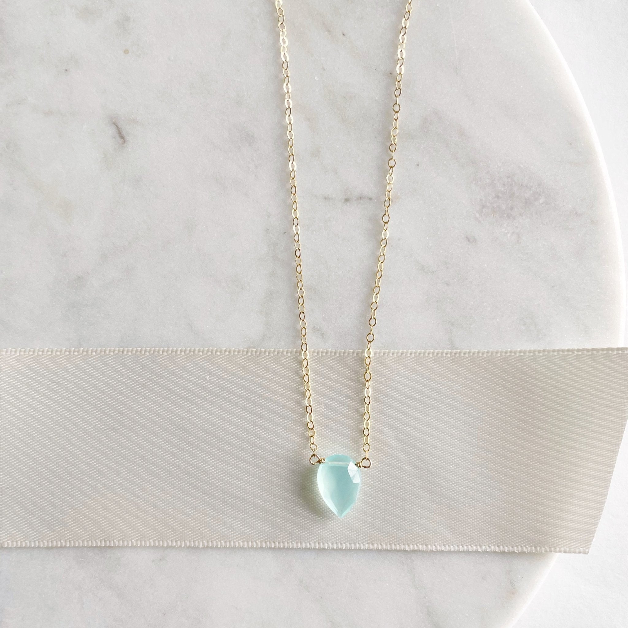 17 inch gold pendant necklace with teardrop shaped aqua chalcedony pendant. Hampton Necklace by Sarah Cornwell Jewelry