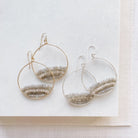 2 pairs of gold and silver gemstone statement 2 inch hoop earrings with rows of zircon, labradorite, and smokey topaz gemstones. Harper Earrings by Sarah Cornwell Jewelry