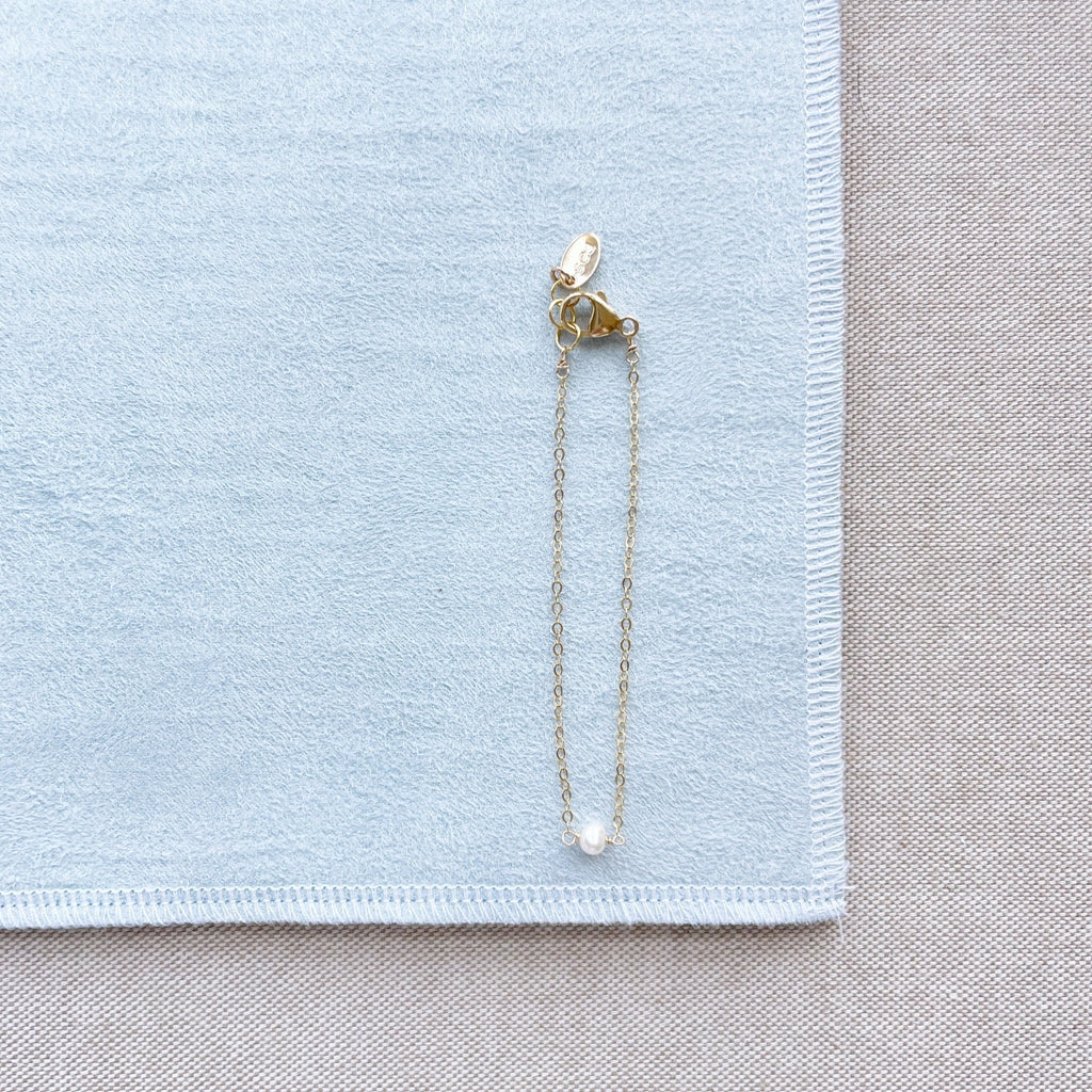 Gold and pearl bracelet with single pearl. La Mere Bracelet by Sarah Cornwell Jewelry