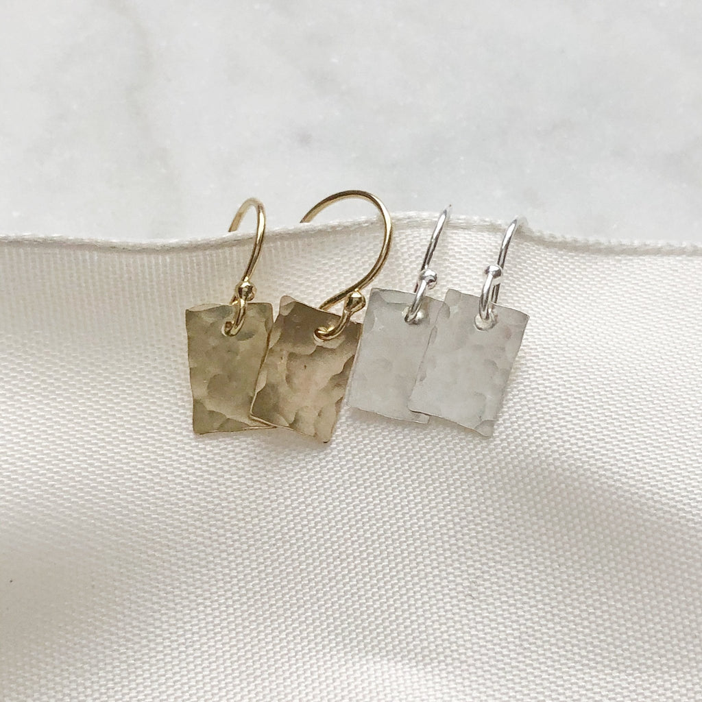 Gold and Silver Lordes Earrings by Sarah Cornwell Jewelry.  2 pairs of dainty, shimmery, gold and silver textured  rectangle earrings on a white background.