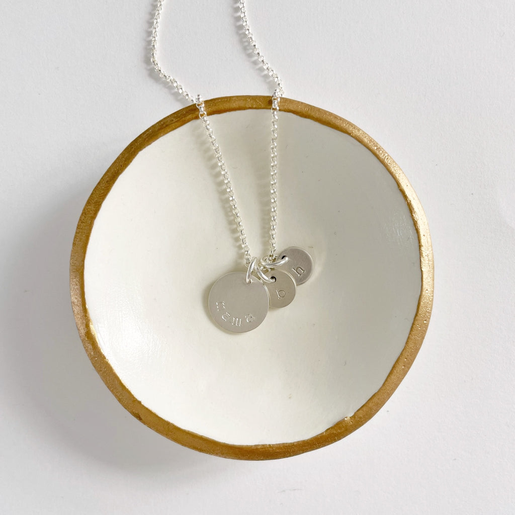 Silver mama stamped disc necklace with 2 tiny stamped initial discs. Mama Necklace by Sarah Cornwell Jewelry