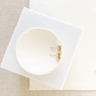 Side view of 14K gold and 1 carat rectangular cut peach pink tourmaline stud earrings. Michelle Studs by Sarah Cornwell Jewelry