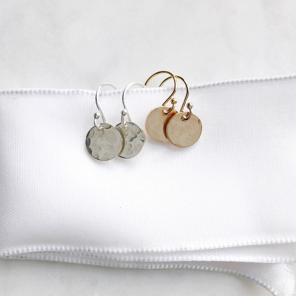 Gold and Silver Monica Earrings by Sarah Cornwell Jewelry.  2 pairs of shimmery, dainty gold and silver 3/8 inch textured disc earrings on a white background.