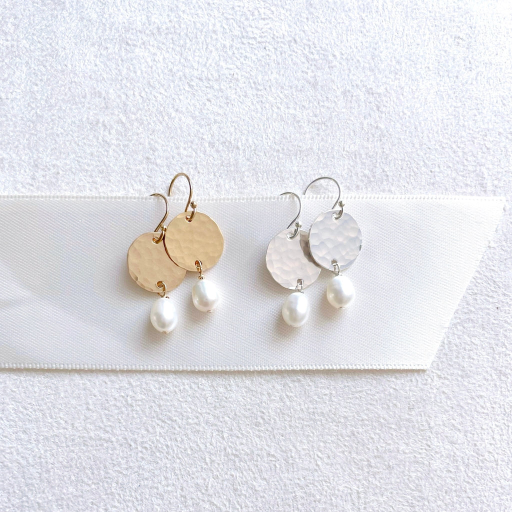 2 pairs of gold and silver 1 inch drop earrings with a textured .5 inch disc and a freshwater pearl drop. Olivia Earrings by Sarah Cornwell Jewelry