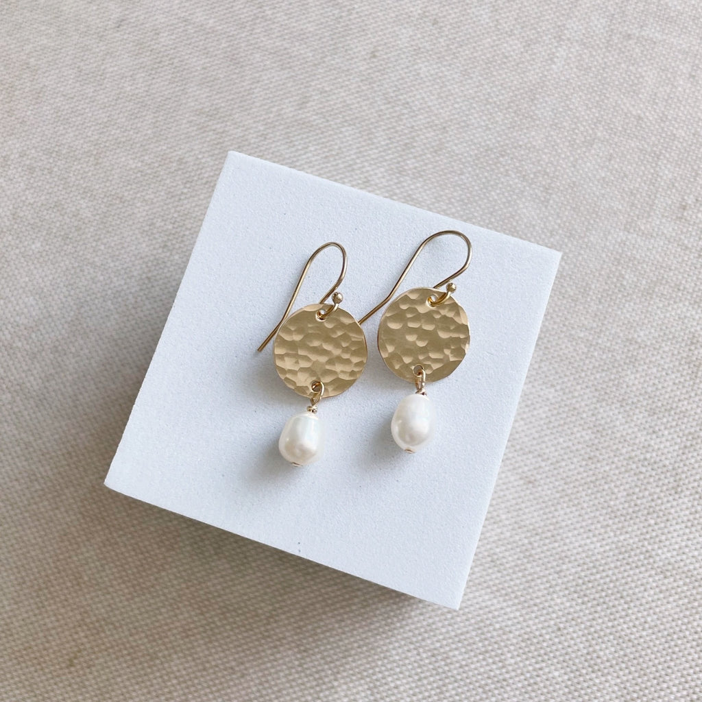 Gold 1 inch drop earring with a gold textured .5 inch disc and a freshwater pearl drop. Olivia Earrings by Sarah Cornwell Jewelry