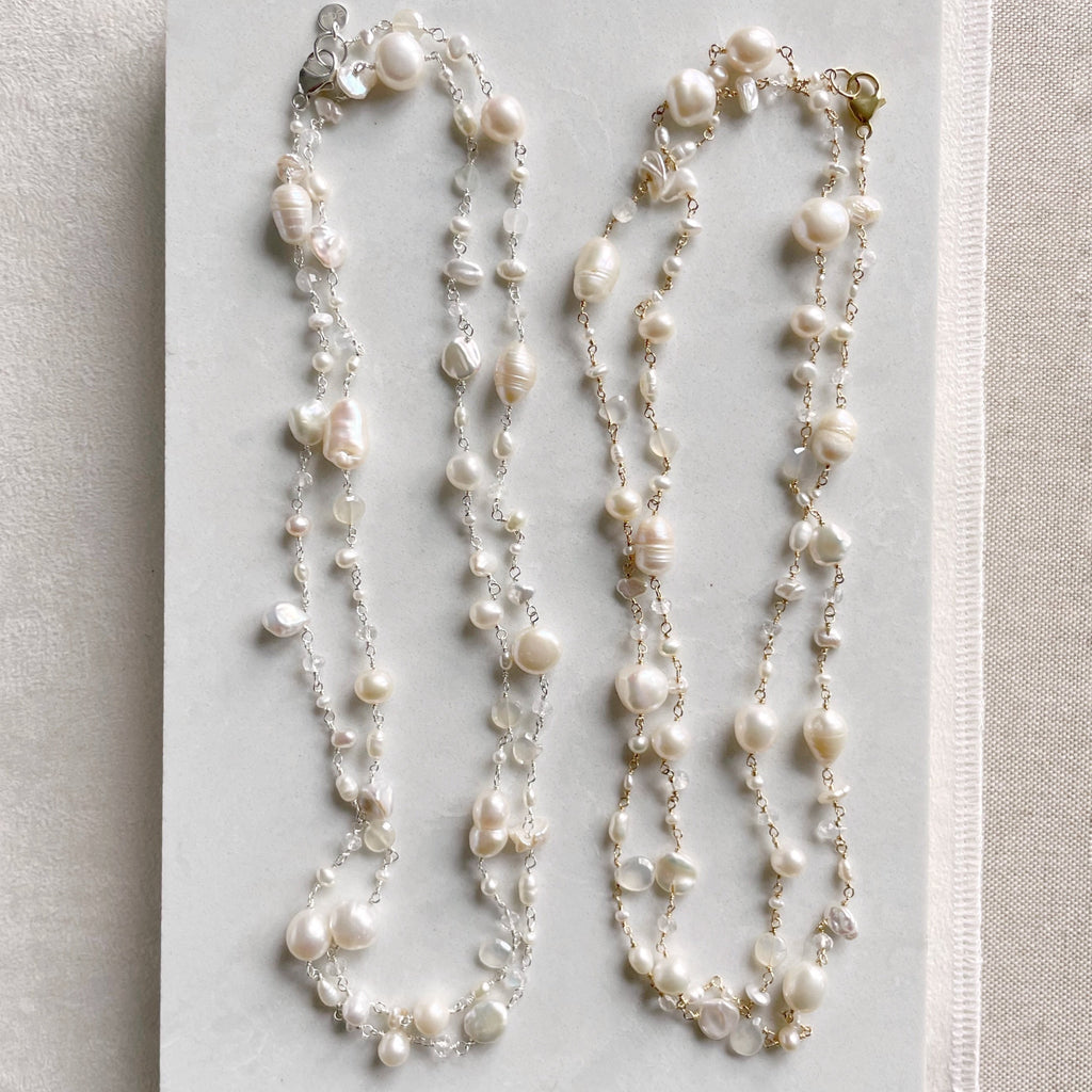 Both gold and silver pearl and gemstone long statement pearl necklaces with wire wrapped moonstone, white chalcedony, white topaz, and freshwater pearls. Poppy Linen necklace by Sarah Cornwell Jewelry