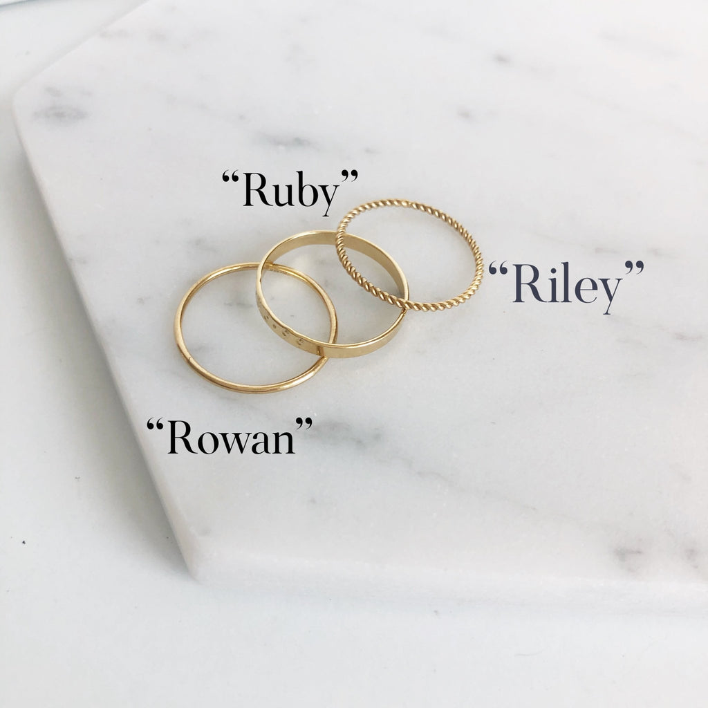 3 gold rings of various styles with the names Ruby, Riley and Rowan. Riley Ring by Sarah Cornwell Jewelry