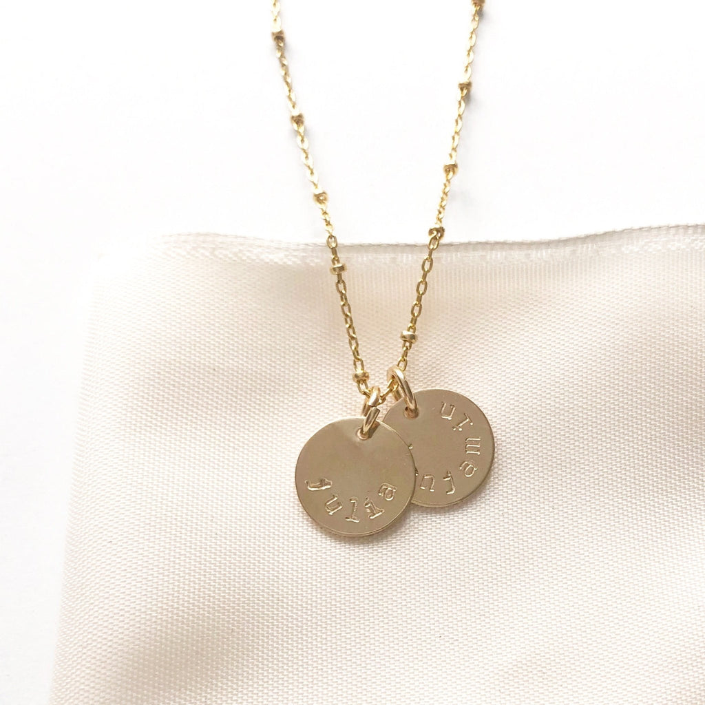Gold stamped disc necklace with link ball chain and 2 personalized stamped name discs. Stella Necklace by Sarah Cornwell Jewelry